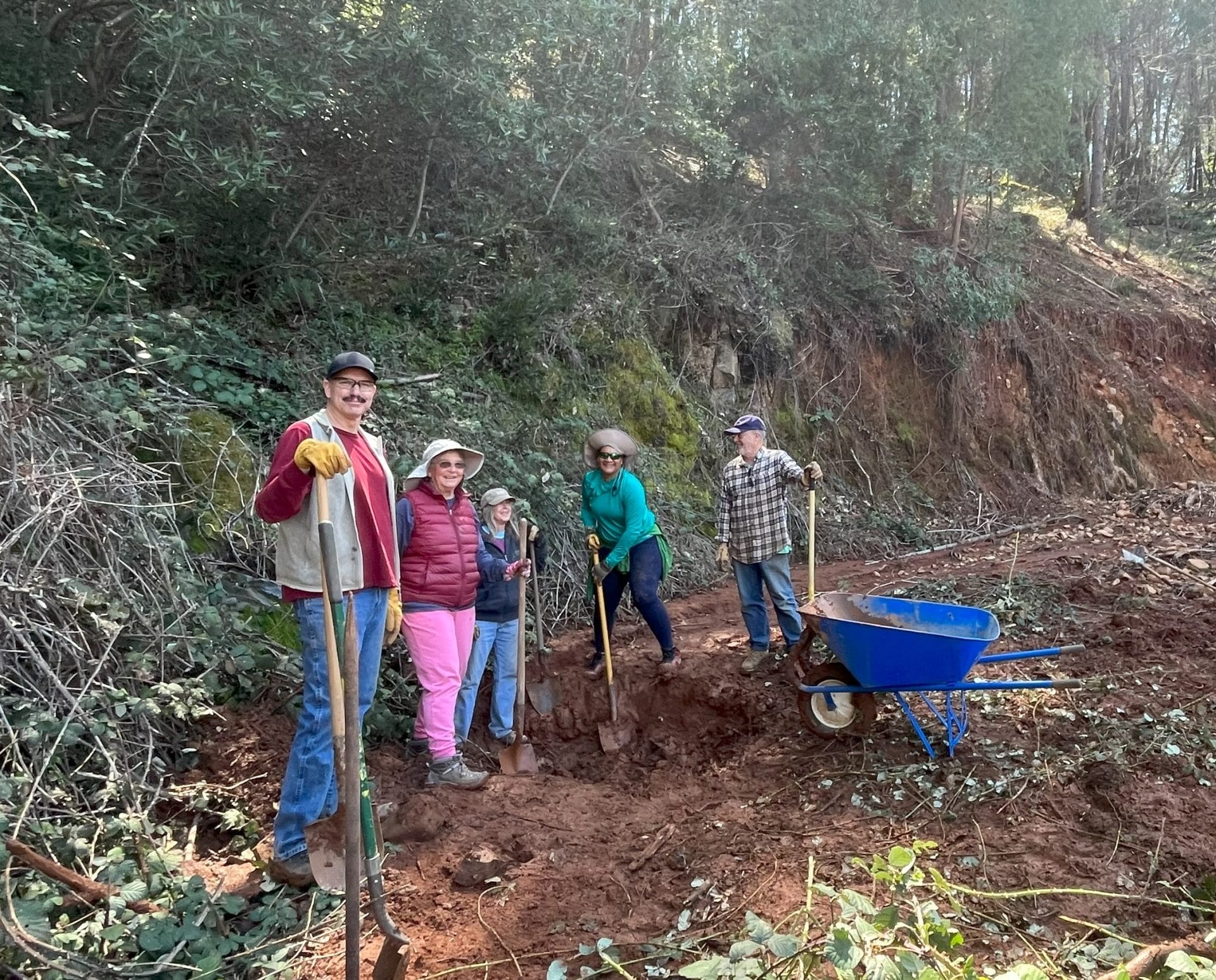 A muddy excavation site where ARC staff repaired a washed-out culvert at Lewis Ranch after a landslide.
