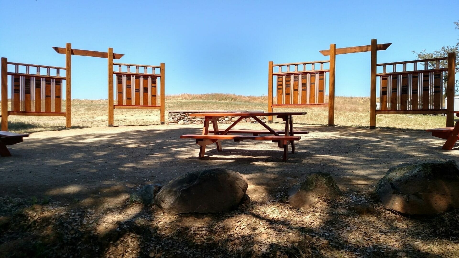 A community gathering at Wakamatsu Farm with visitors of all ages.